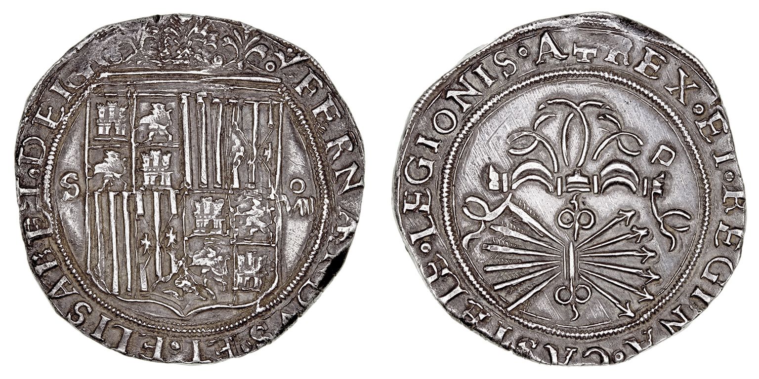 Two sides of an old silver coin stamped with the crest and sigil of the Spanish monarchy.